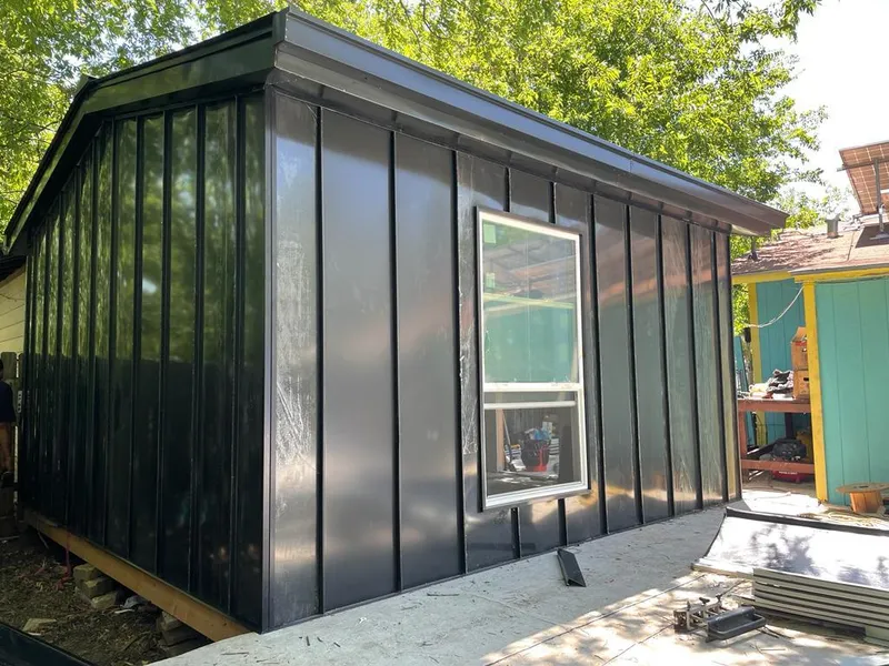 Black standing seam metal wall panels for Roof Inspection in Penfield