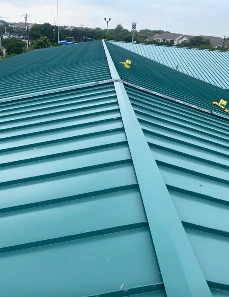 Green commercial metal roof ridge and valley for Metal Roof Repair in Penfield