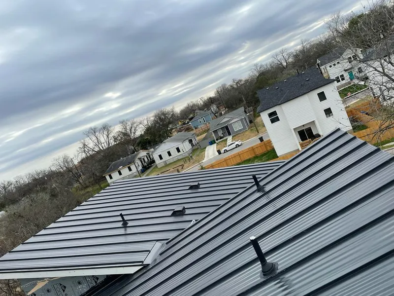 Standing seam metal roof panels with vents for Skylight Repair in Penfield